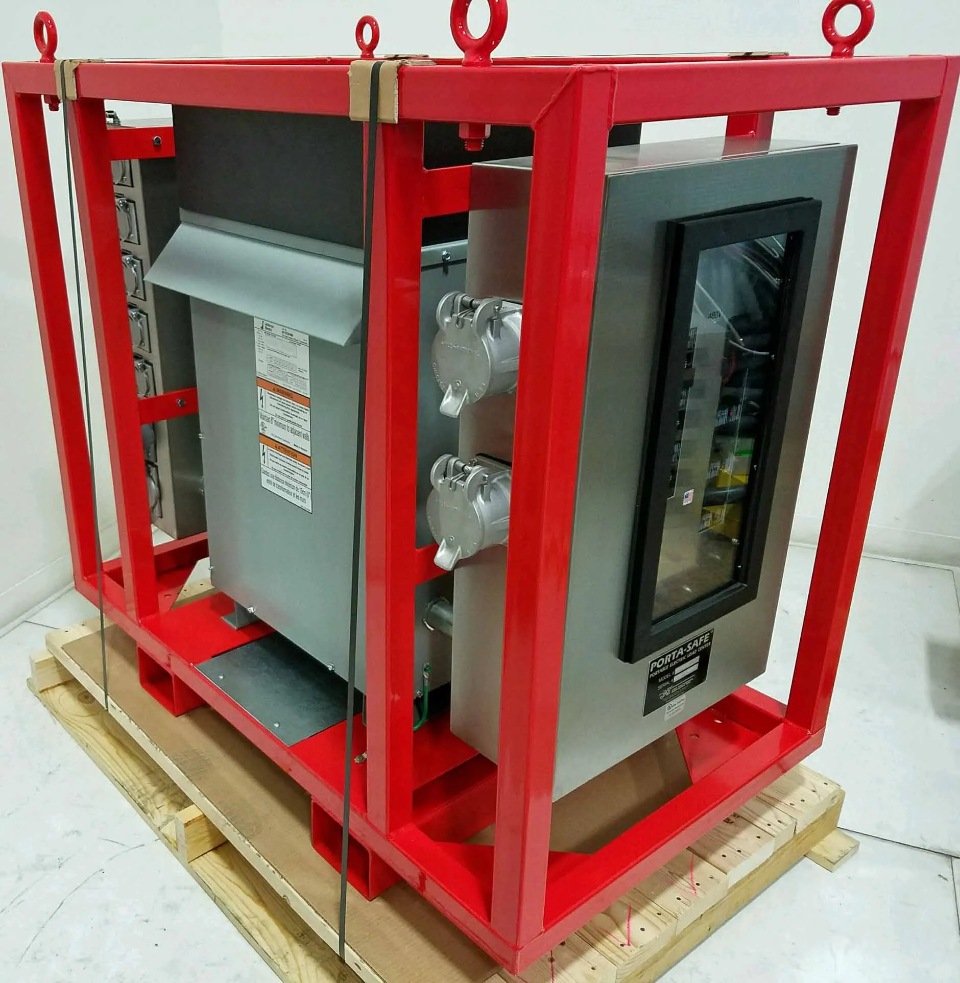 Porta-Safe temporary power distribution unit: a transformer and breaker panel with GFCI receptacles inside a red steel lifting frame