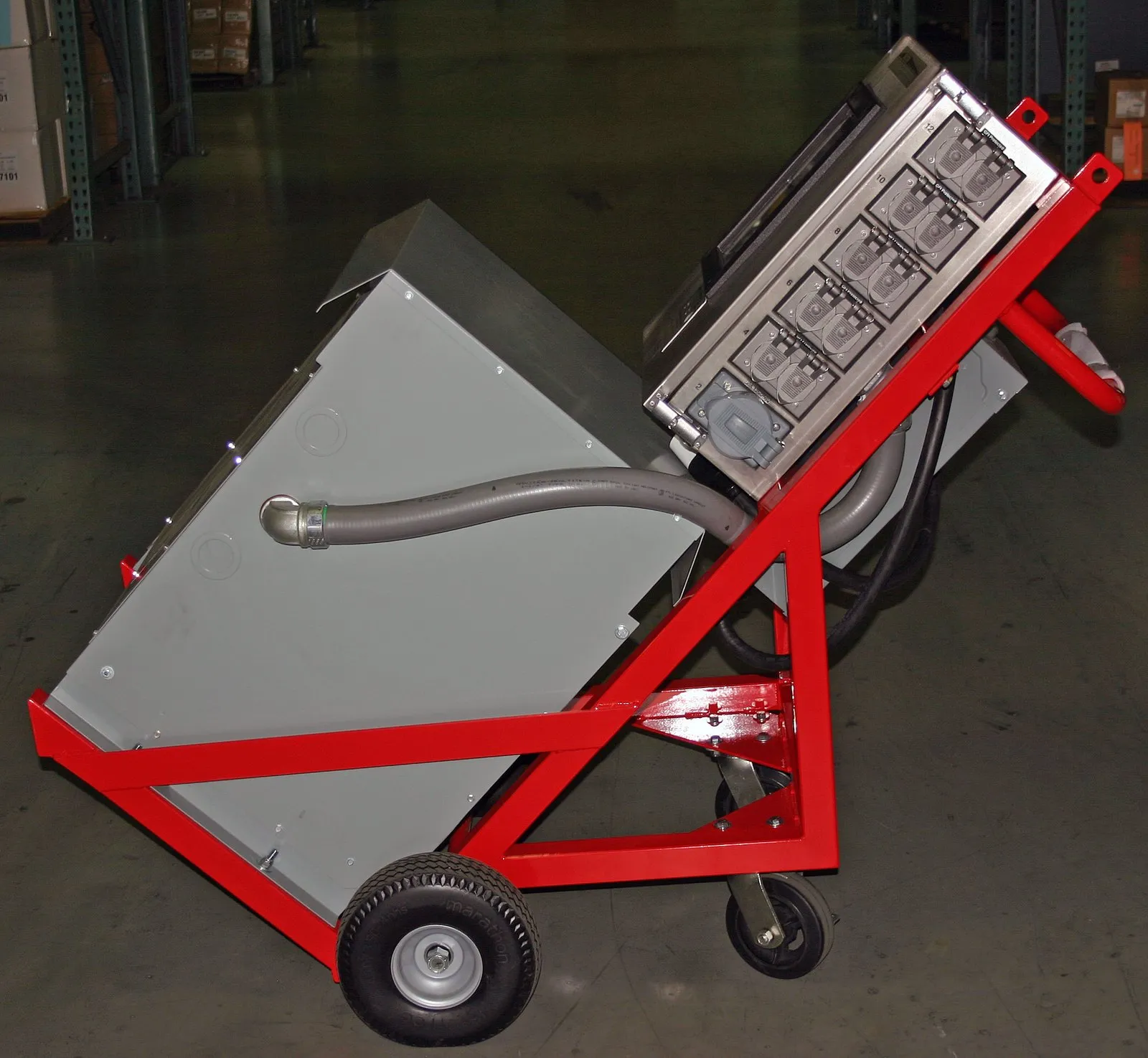 Two-wheel Porta-Safe cart with transformer, breaker panel and GFCI receptacles in a red frame